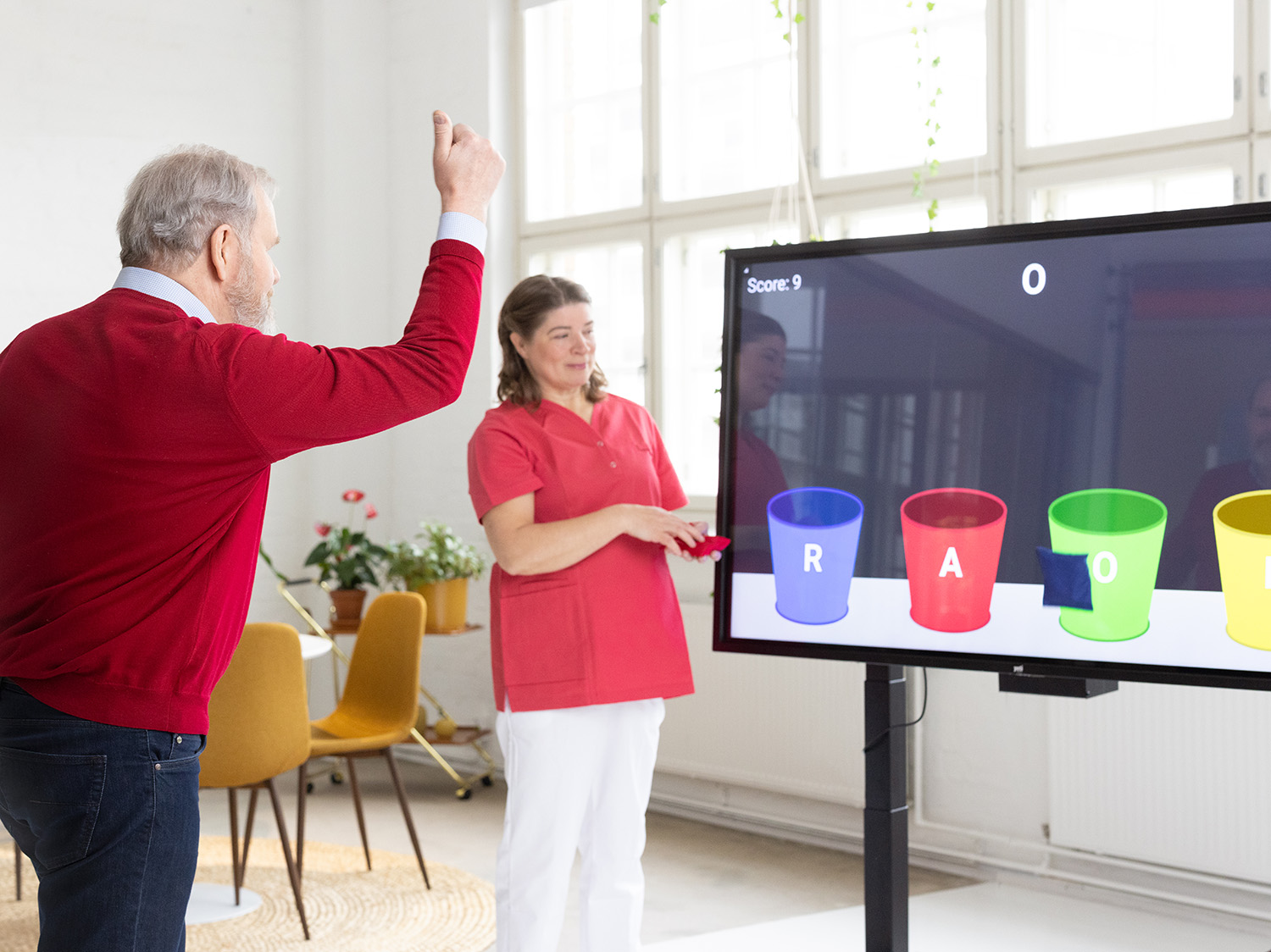 A man playing YetiCare's coordination game with Yetitablet