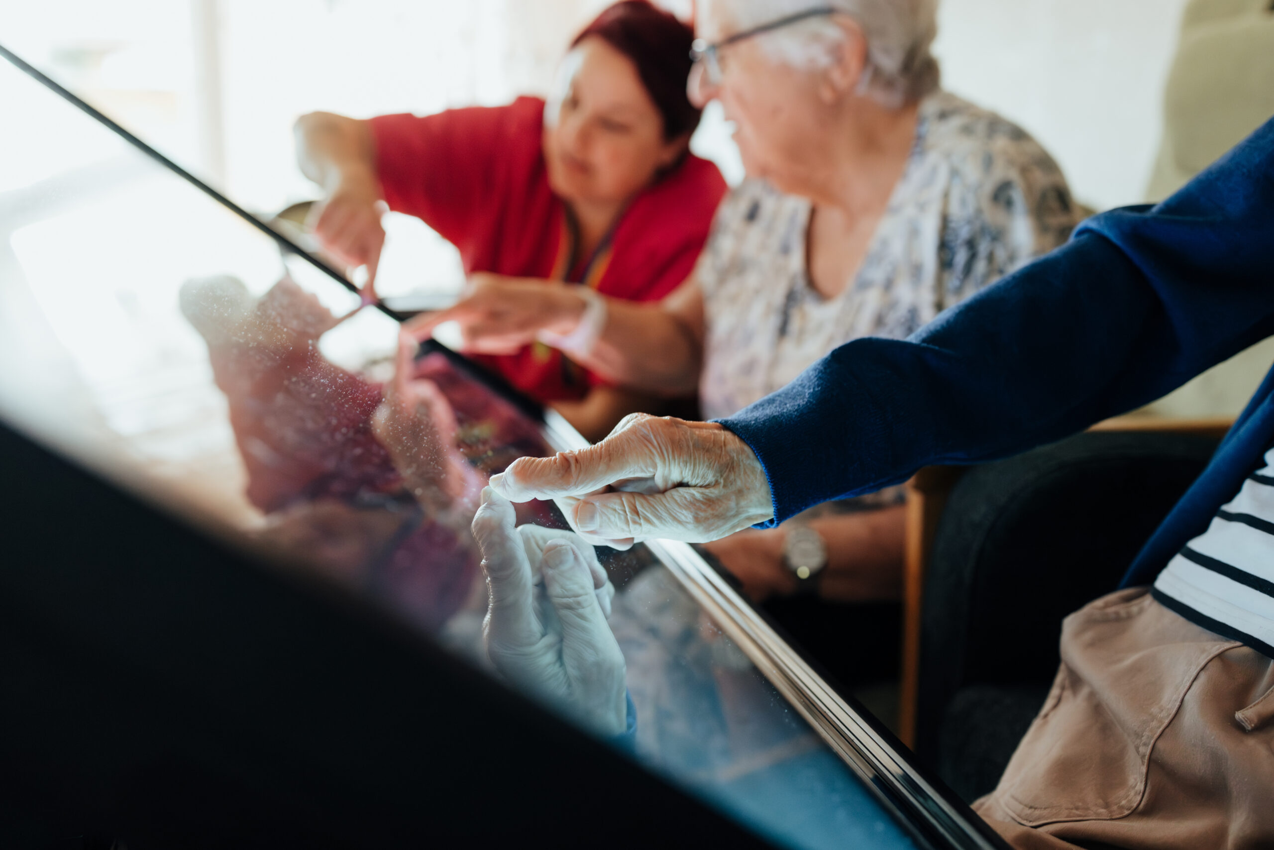 An older woman touching Yetitablet's screen